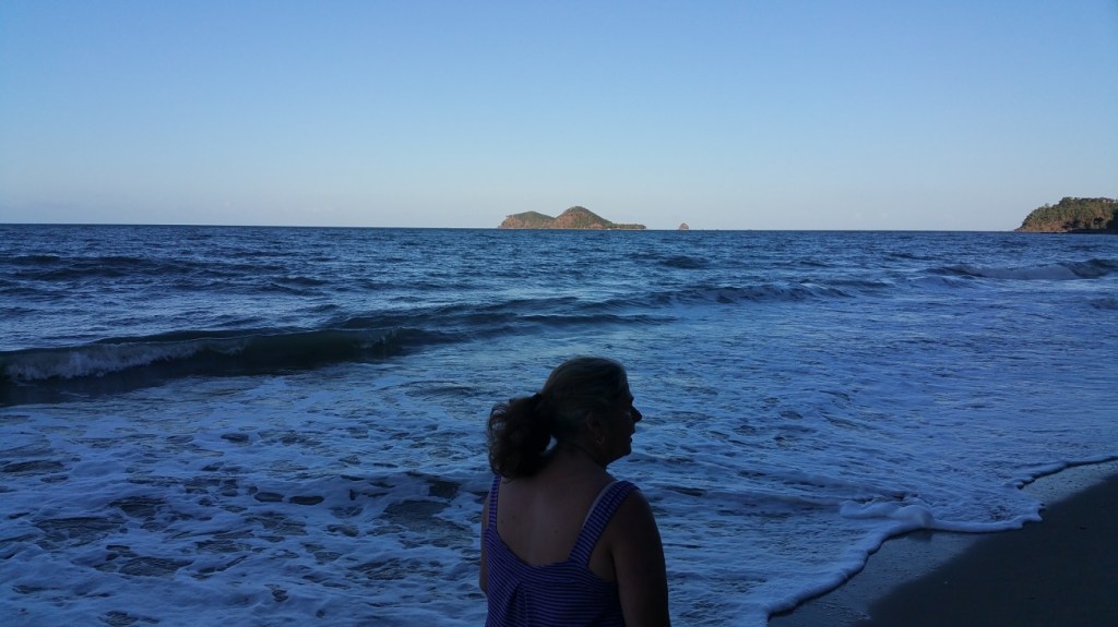 Jo walking the beach.