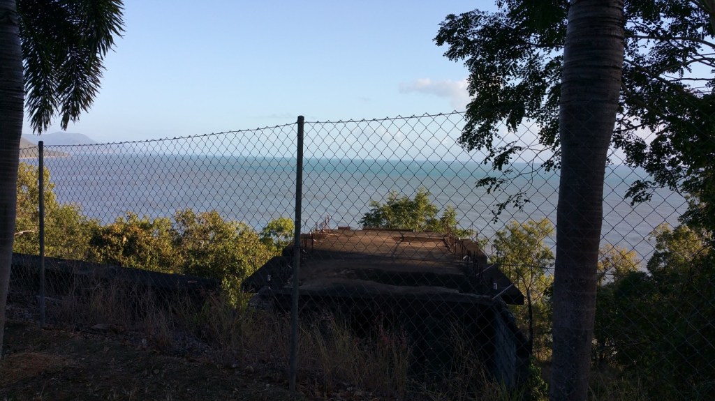 Overlooking an abandoned building site on the headland between Palm Cove and Ellis beach. I have no idea what the structure was mean to be but the driveway is really steep and ends in the bush.