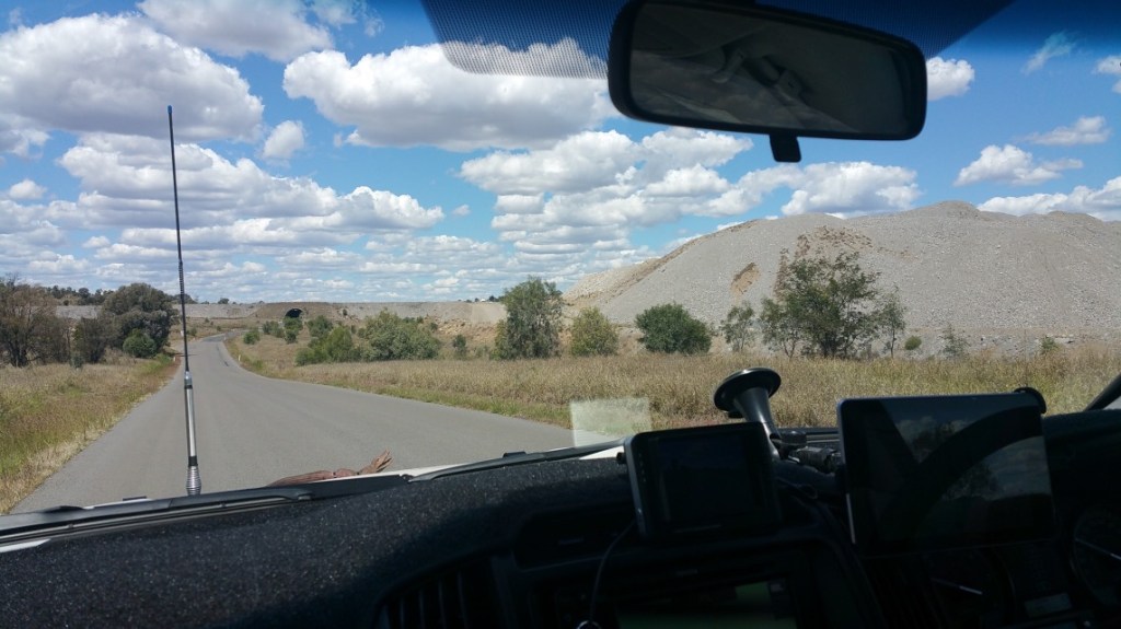 Yet another man made mountain - this the road goes under it (the tunnel in the distance)